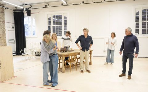 Jasper Talbot holds Ellie Bamber. She cries with her head on his shoulder. Charles Edwards, Claudia Harrison, Robert Portal and Leo Suter stand around them, looking on with both concern and annoyance.