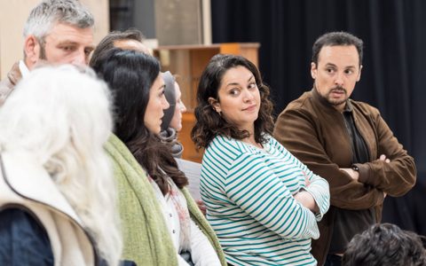 Mona Goodwin and Rachid Sabitri stand with their arms crossed looking over to their right at Leila Farzad.