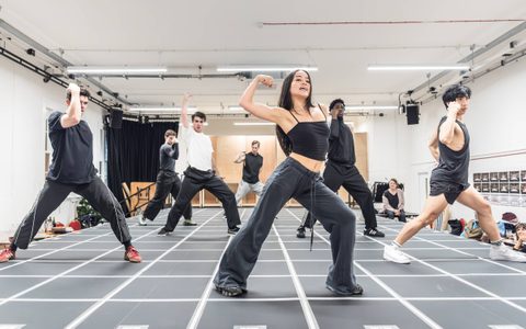 The American Psycho company rehearsing choreography, with Hannah Yun Chamberlain at the front.