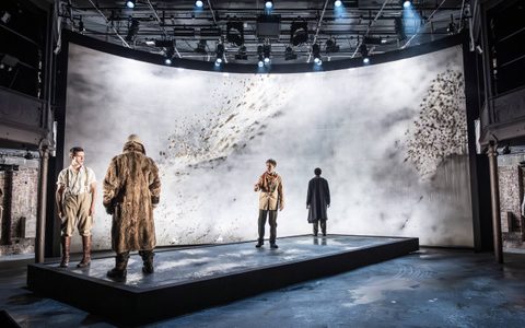 Declan Conlon, Oliver Johnstone, Stuart Thompson, and Kyle Soller stand on a revolving rectangular platform.