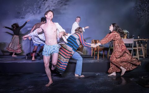 The Romans company dance wildly on stage.