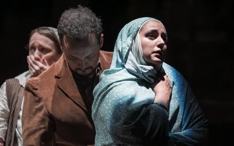 Mona Goodwin, Rachid Sabitri and Nadia Albina stand in a dark room.