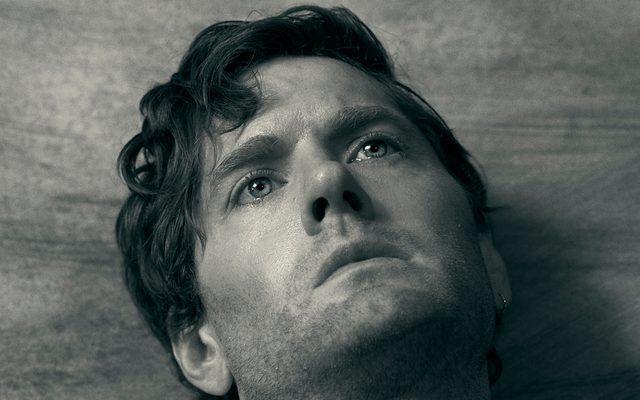 A close crop of Kyle Soller's face in black and white.
