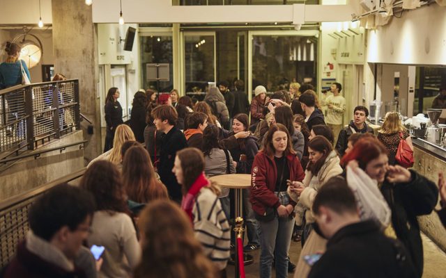 People mingling in the Almeida Theatre Bar.