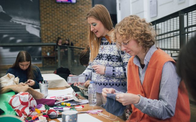 People participating in a craft activity.
