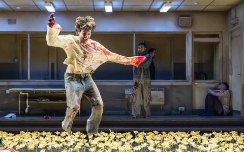 Luke Cinque-White happily dances through a field of daffodils covered in blood. Parth Thakerar looks on from behind.